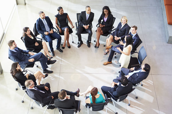 Group of Region 6 members sitting in a circle. Group of Region 6 members sitting in a circle.